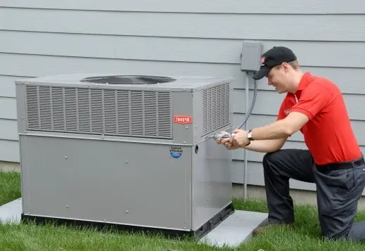 Cozy Conditions technician servicing an outdoor HVAC unit